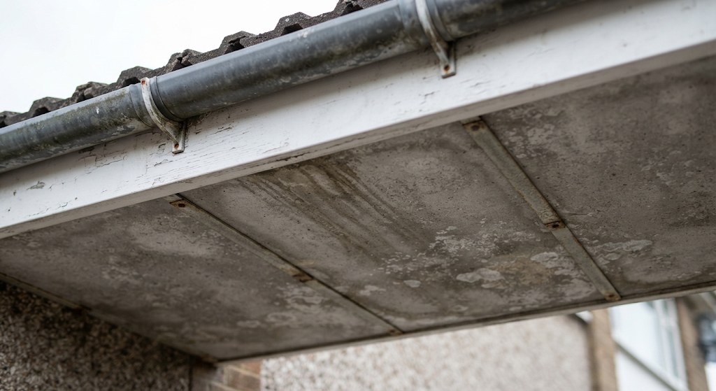 Cement soffit boards under 1960s eaves.